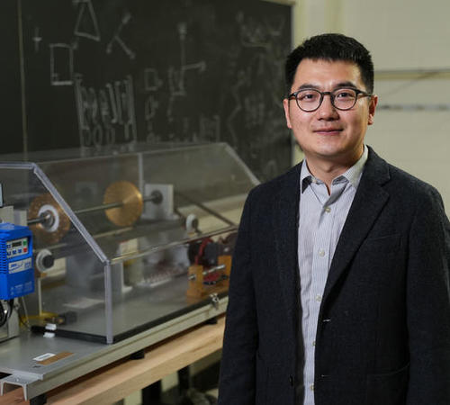 Edward Wang standing in his lab.